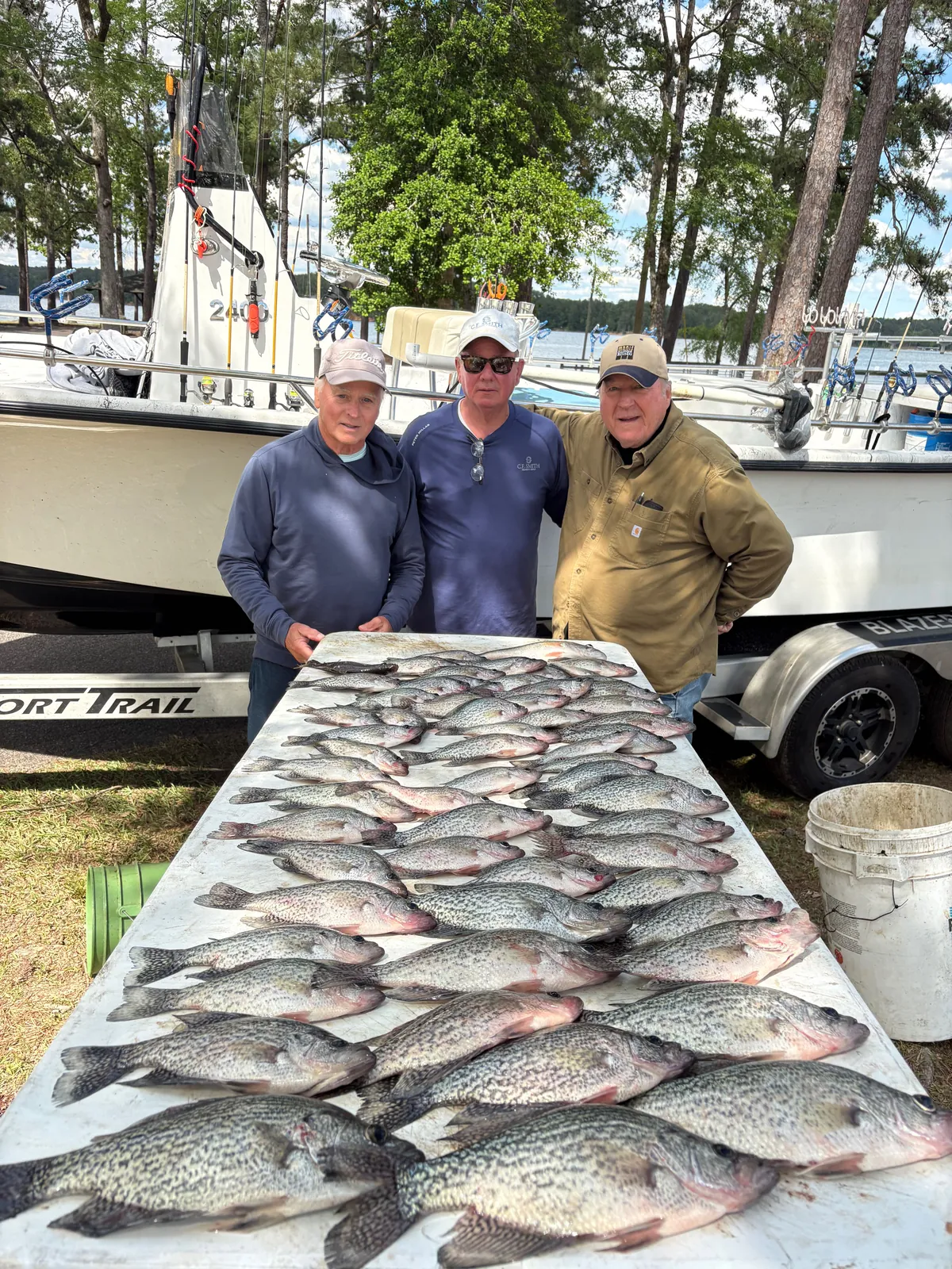 A large catch of crappie covering the fish-cleaning table